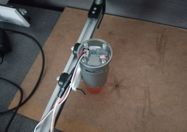 Figure 5. Laser installation (Next to the laser, a test pattern is visible, which was used to determine the initial calibration of the laser and plotter)